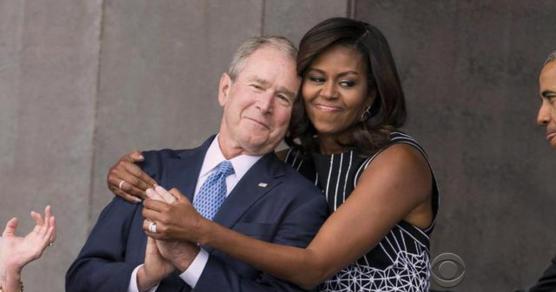 Michelle Obama hugs George Bush at the opening of the National Museum of African American History and Culture.
