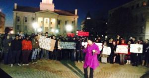 Image of letter author, Kendra Malone, holding a megaphone at a rally on the Pentacrest at the University of Iowa (2014)